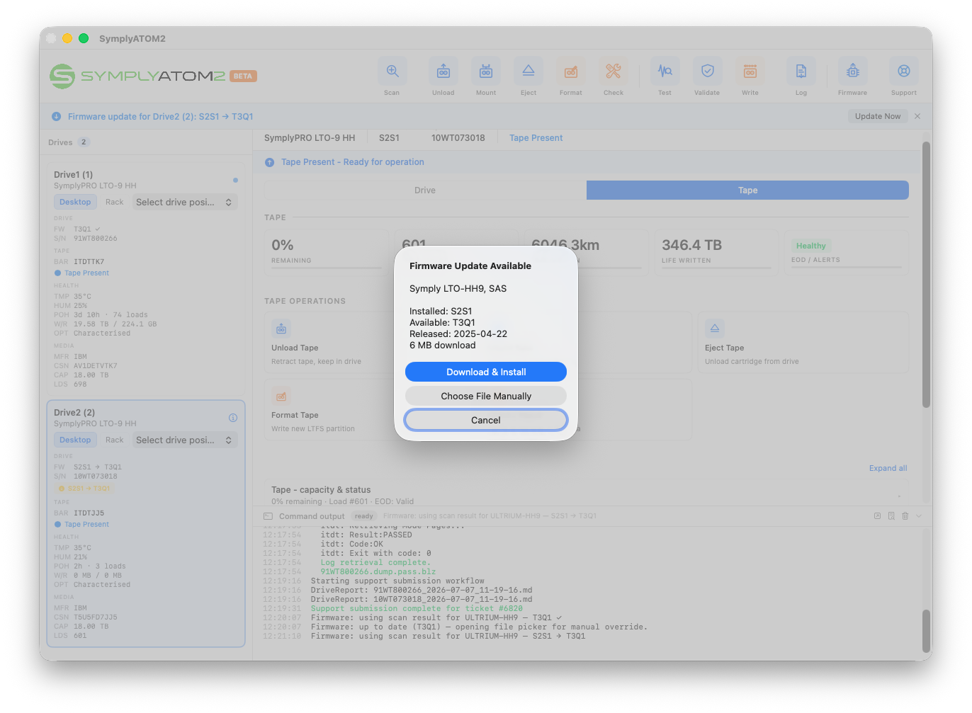 Firmware Update Available dialog for Symply LTO-HH9, SAS showing Installed: S2S1, Available: T3Q1, Released: 2025-04-22, 6 MB download, with Download and Install, Choose File Manually, and Cancel buttons